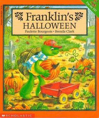 Franklin the turtle holding a pumpkin