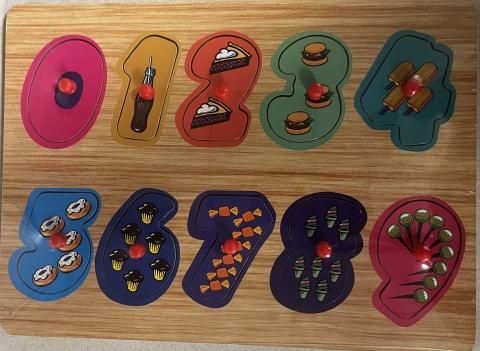 numbers 0-9, all in different colors with easy pegs to pick them up.