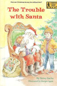 A young child sitting on santa's lap, and a young boy standing next to them with his hands on his hips looking mad