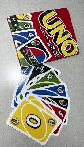 Uno cards laid out to show the braille on the corner of the cards.