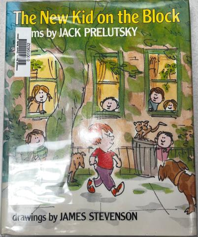 An apartment like building with kids looking out the windows to a ginger kid with mean look on his face strutting down the sidewalk.