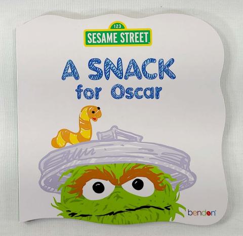 Oscar the grouch looking over the bottom of the book