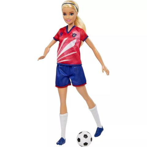 Soccer Player Barbie with her foot in motion to kick the soccer ball