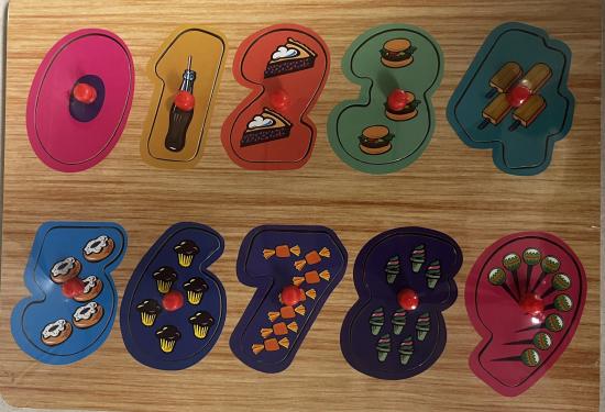 numbers 0-9, all in different colors with easy pegs to pick them up.