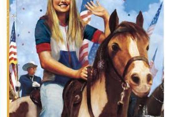 A blonde girl waving while riding a horse