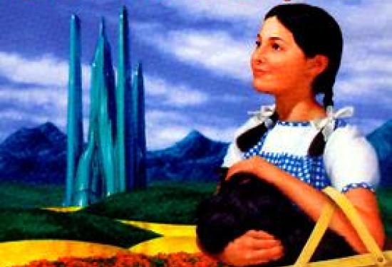 Dorothy holding toto in a basket smiling, looking into the distance while standing in a poppy field with the yellow brick road leading to a castle