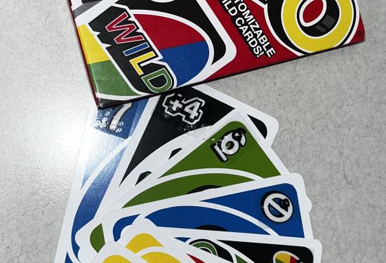 Uno cards laid out to show the braille on the corner of the cards.