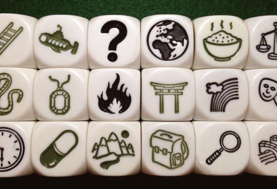 Some of the dice with various symbols that can be rolled