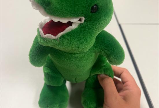 small green dinosaur with an open mouth