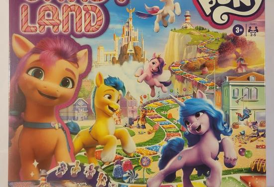 The box cover with multiple ponies on the front