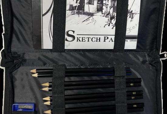 A little black case with a sketch book on one side and various size pencils on the other side with a sharpener and an eraser